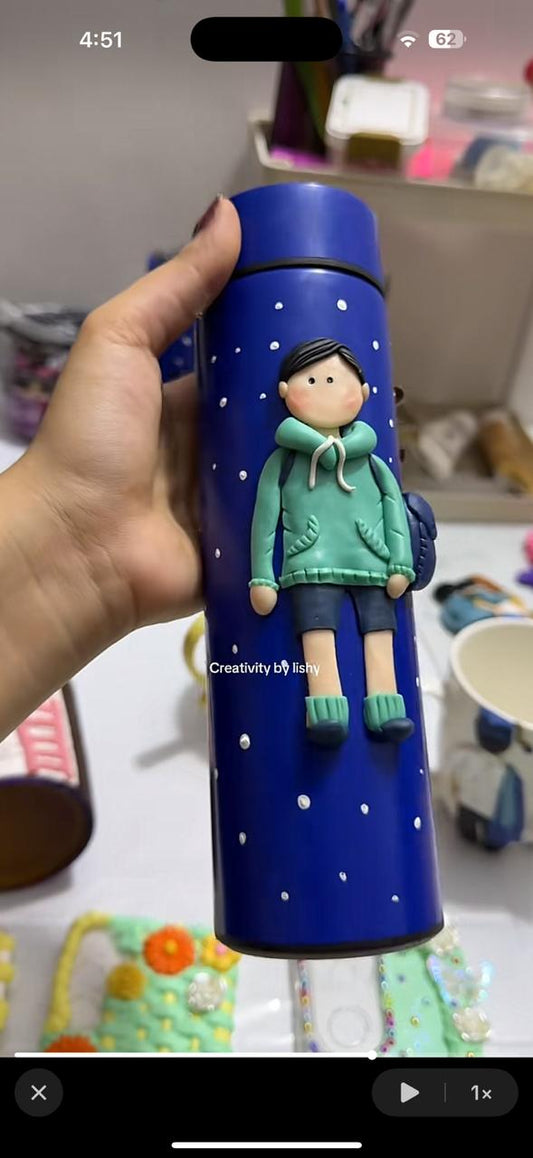 Young school boy temperature bottle