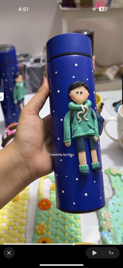 Young school boy temperature bottle